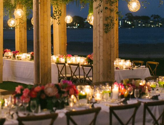 Rustic looking table setting at a rehearsal dinner overlooking Mission Bay at the Catamaran Resort Hotel